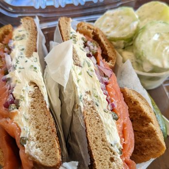 Long Island Bagel Cafe - Stony Brook - Flagel with scallion CC, lox, capers, Dill and red onion...side of cucumber dill salad - Delis Near Me - Stony Brook, New York Long Island Bagel Cafe - Stony Brook - Flagel with scallion CC, lox, capers, Dill and red onion...side of cucumber dill salad - Delis Near Me - Stony Brook, New York