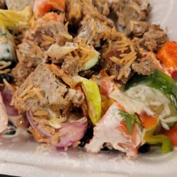 Shahs Halal - This is suppose to be lamb over rice with salad. Look how big the cucumber and tomatoes are cut. It didn't taste fresh in addition to this.