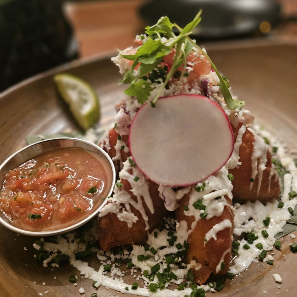 Zoukmaya - SHRIMP EMPANADAS Stuffed with shrimp, mozzarella, sour cream, cabbage, pico de gallo, salsa mexicana, cotija cheese. - Latin American Near Me - Forest Lake, Minnesota
