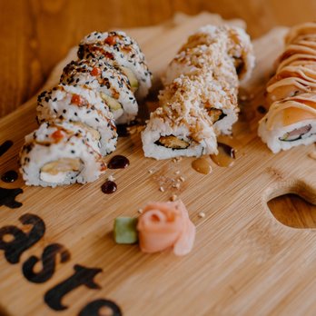 Taste - sushi rolls on a wooden cutting board - Tapas/Small Plates Near Me - South Haven, Michigan