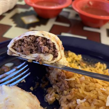 Casa Garcia - a hand holding a fork and a plate of food - Mexican Near Me - Plymouth, North Carolina Casa Garcia - a hand holding a fork and a plate of food - Mexican Near Me - Plymouth, North Carolina