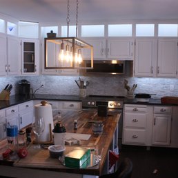 a kitchen with white cabinets a kitchen with white cabinets