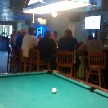 Silver Dollar Saloon - a pool table with a pool ball on it - Sports Bars Near Me - Plant City, Florida Silver Dollar Saloon - a pool table with a pool ball on it - Sports Bars Near Me - Plant City, Florida