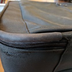 Davis St Shoe & Luggage Repair - New leather corner replacing the one trashed by the airlines