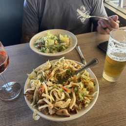 Asian chicken salad and Caesar salad with "Can we be friends" IPA and a glass of Rose