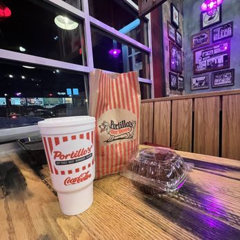 Portillo's - a cup of coffee and a donut on a table - Fast Food Near Me - Sterling Heights, Michigan Portillo's - a cup of coffee and a donut on a table - Fast Food Near Me - Sterling Heights, Michigan