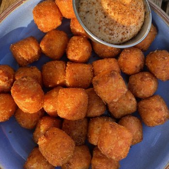 The Cellar - Addicting light airy crisp sweet potato tots with a tasty slightly spicy aioli type dipping sauce. - Wine Bars Near Me - San Clemente, California The Cellar - Addicting light airy crisp sweet potato tots with a tasty slightly spicy aioli type dipping sauce. - Wine Bars Near Me - San Clemente, California