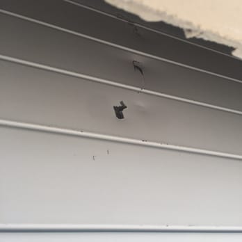 Atlas Door & Gate, Inc - Damaged door by installers ! - Garage Door Services Near Me - Medley, Florida Atlas Door & Gate, Inc - Damaged door by installers ! - Garage Door Services Near Me - Medley, Florida