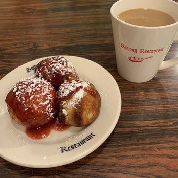 Solvang Restaurant - Aebleskiver, a Danish Pastry, which is like a pancake ball. They drizzle raspberry sauce and powdered sugar on top. -- very good! - Scandinavian Near Me - Solvang, California Solvang Restaurant - Aebleskiver, a Danish Pastry, which is like a pancake ball. They drizzle raspberry sauce and powdered sugar on top. -- very good! - Scandinavian Near Me - Solvang, California