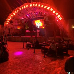 people sitting on bean bags in front of a stage people sitting on bean bags in front of a stage