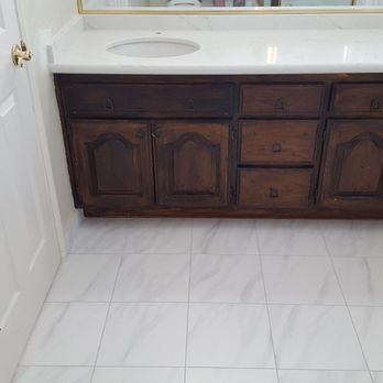 Trinidad Tile and Granite - Custom fitted and honed quartz bathroom counter with new floor tile and original vanity and mirror - Flooring Near Me - La Habra, California