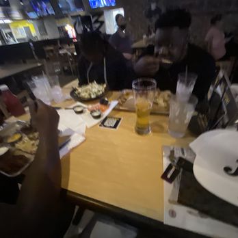 Buffalo Wild Wings - a group of people sitting at a table - Sports Bars Near Me - Ridgeland, Mississippi Buffalo Wild Wings - a group of people sitting at a table - Sports Bars Near Me - Ridgeland, Mississippi