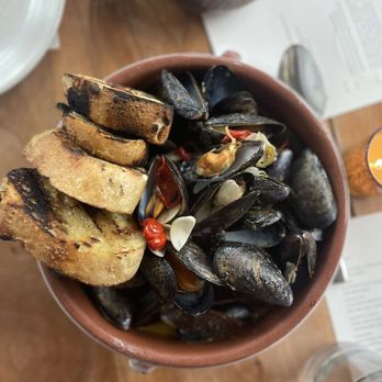 Martina - Hot Appetizer: One Pound Mussels with Country Bread (sea urchin, lime, white wine) - Argentine Near Me - Minneapolis, Minnesota Martina - Hot Appetizer: One Pound Mussels with Country Bread (sea urchin, lime, white wine) - Argentine Near Me - Minneapolis, Minnesota