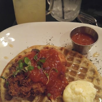 Crave - CHICKEN and WAFFLES topped with hot sauce A MUST - New American Near Me - Akron, Ohio