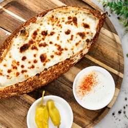 Turkish pizza bread with mozzarella and mixed sesame topping.