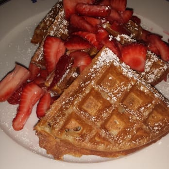 Bouchon - Sourdough waffles with strawberries. Served with Tahitian vanilla butter and syrup. - French Near Me - Las Vegas, Nevada Bouchon - Sourdough waffles with strawberries. Served with Tahitian vanilla butter and syrup. - French Near Me - Las Vegas, Nevada