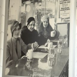 1930 picture 3 white women eating in a restaurant blacks cannot dine in.  Only pic in the restaurant in a diverse community.
