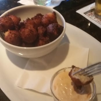 Page Road Grill - Shrimp/corn hush puppies with house made pimento cheese dip - New American Near Me - Durham, North Carolina Page Road Grill - Shrimp/corn hush puppies with house made pimento cheese dip - New American Near Me - Durham, North Carolina