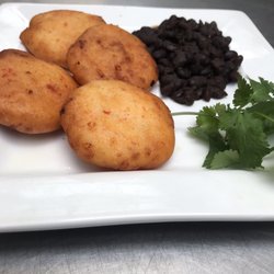 Arepas with refríes black beans