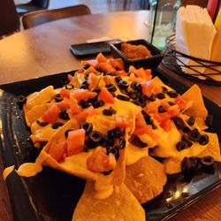 Kings Bar & Grill - Plain nachos. Good cheese sauce and don't sleep on the salsa.