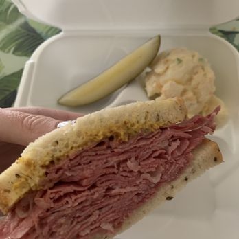Kosher Bite - Corned beef sandwich on rye with mustard, and a side of potato salad. - Delis Near Me - Laguna Hills, California Kosher Bite - Corned beef sandwich on rye with mustard, and a side of potato salad. - Delis Near Me - Laguna Hills, California
