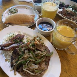 Executive lunch with sirloin, pasties, mango juice