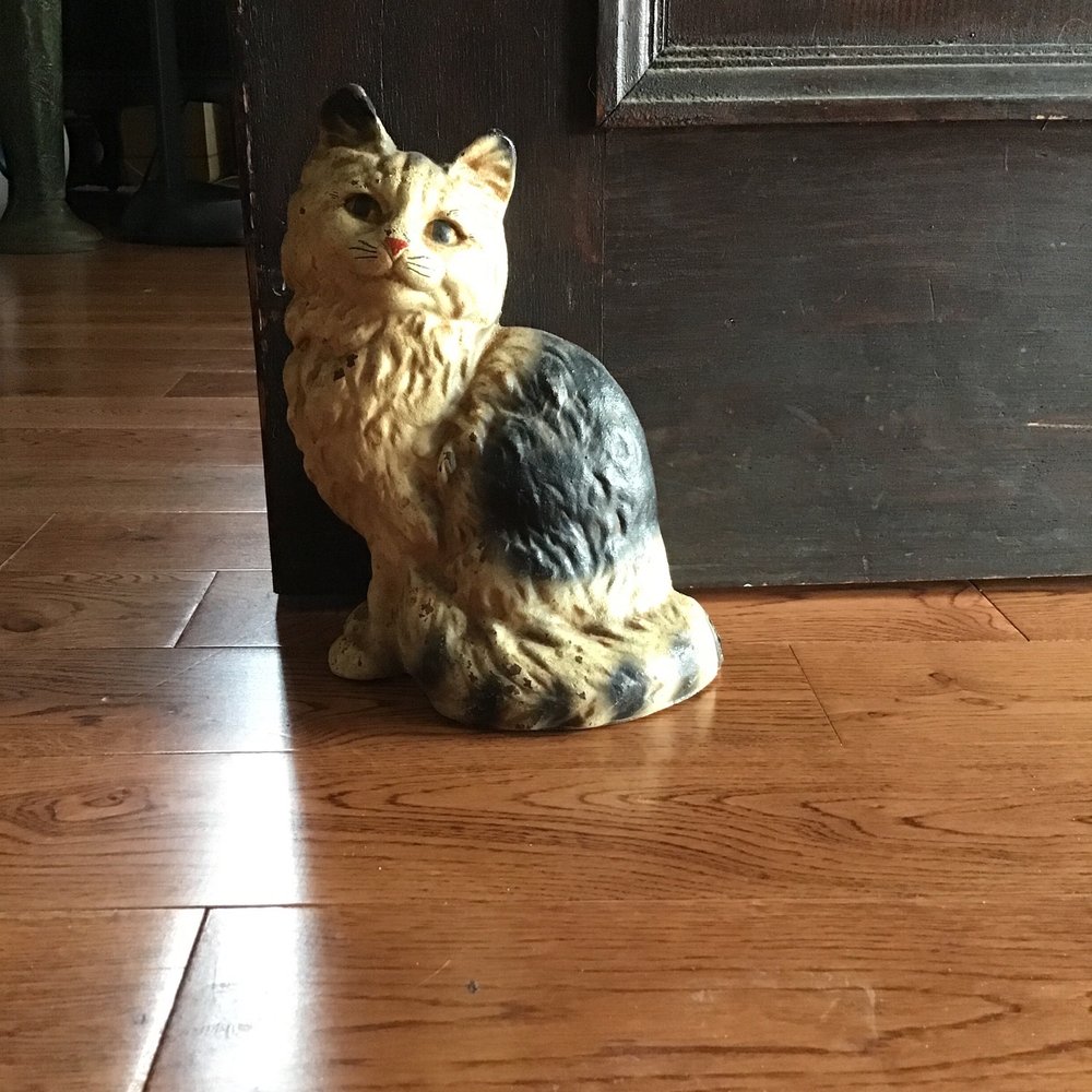 Antique cast iron doorstop.
