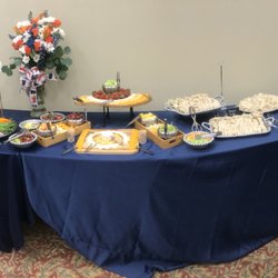 Wilton's Catering - This appetizer spread features several crowd-pleasers: finger sandwiches, fruit and cheese boards, and turkey pinwheels!