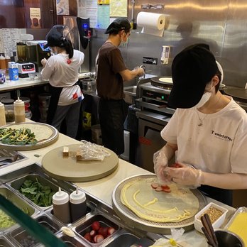 T-swirl Crepe - a woman preparing food in a kitchen - Creperies Near Me - White Plains, New York T-swirl Crepe - a woman preparing food in a kitchen - Creperies Near Me - White Plains, New York