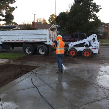 Lianoz Construction - a man standing in front of a dump truck - General Contractors Near Me Lianoz Construction - a man standing in front of a dump truck - General Contractors Near Me