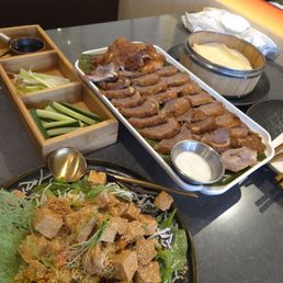Dry duck served alongside thick dry hard crepes.