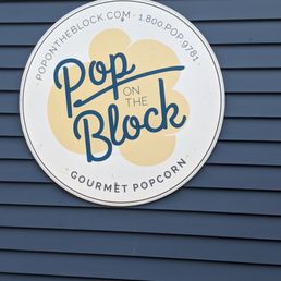 a sign for pop on the block a sign for pop on the block