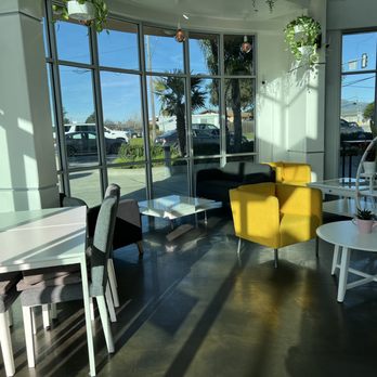 Monky Bowl - a yellow chair and a white table - Juice Bars & Smoothies Near Me - Salinas, California