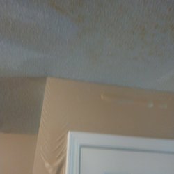 Intouch Property Management Services - 1st flood, water behind paint, pantry door in kitchen