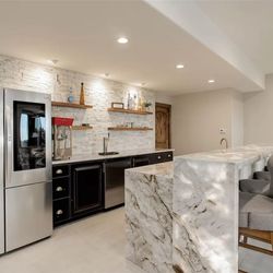 Tony's Granite - Backlit Quartzite Countertops W/ Waterfall Edge