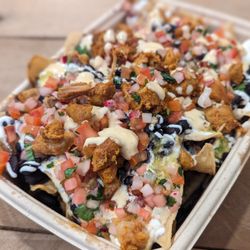 Playa Taqueria - CHICKEN NACHOS nixtamal corn chips,black beans, house made queso, crema, salsa verde pico de gallo, guacamole (optional)