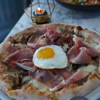 Pie Bar - a plate of pizza with a fried egg on top - Pizza Near Me - Toronto, Ontario