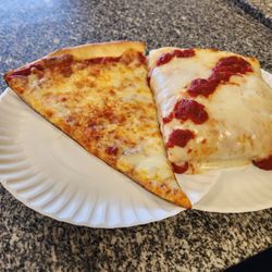 Dominick's Pizzeria - The Sicilian was severely lacking on sauce (it is only on the top) but both slices were pretty good