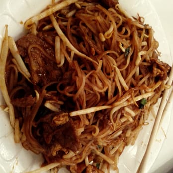 Caribbean Queen - a plate of noodles with meat and chopsticks - Caribbean Near Me - Guelph, Ontario Caribbean Queen - a plate of noodles with meat and chopsticks - Caribbean Near Me - Guelph, Ontario