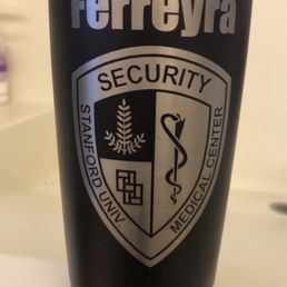 Engraved mug with Stanford Security Hospital logo & employee last name (Ferreyra).