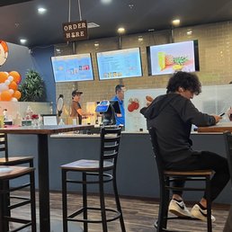 Register in the front, where you place your order. Pick up is farther down the counter. Register in the front, where you place your order. Pick up is farther down the counter.