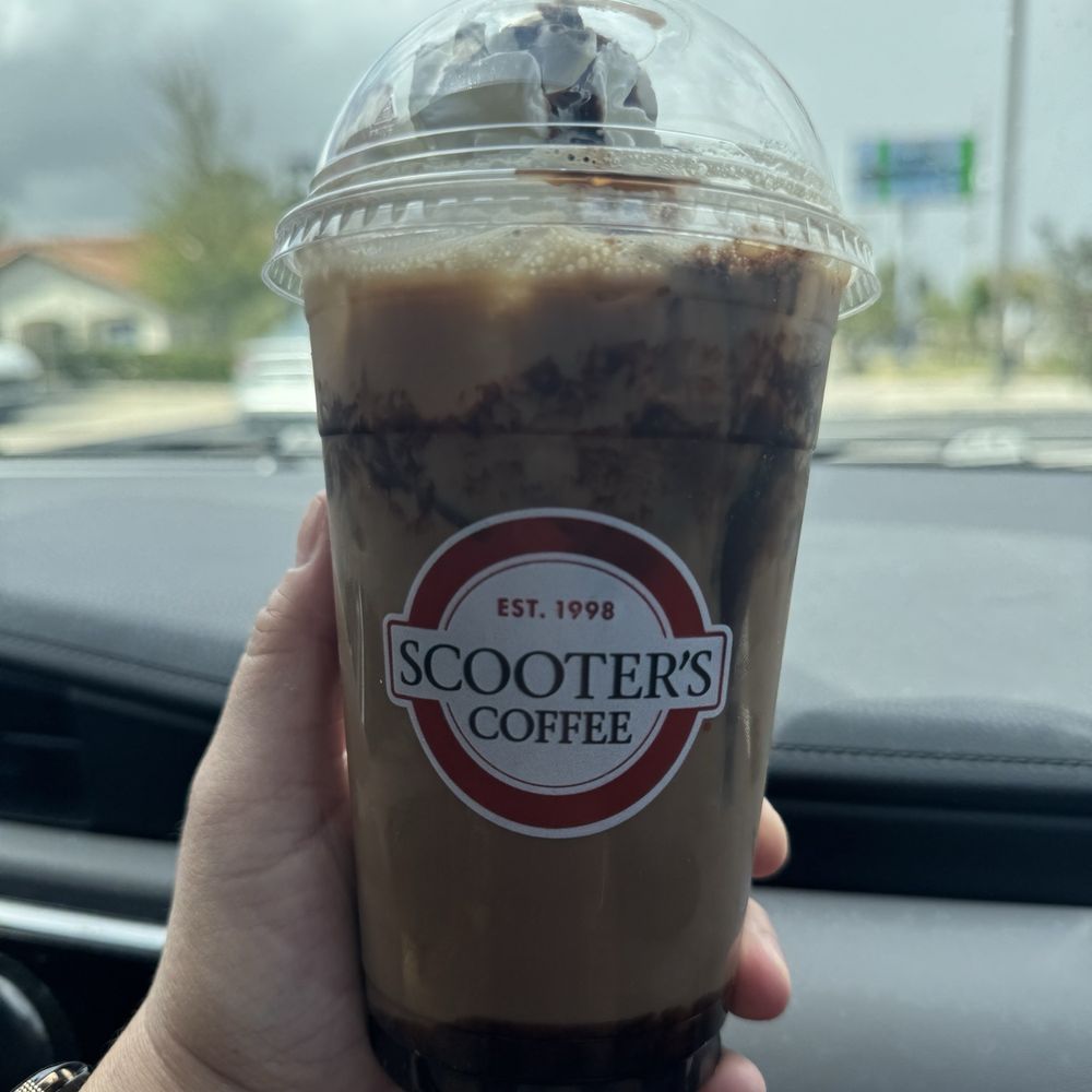 Scooter's Coffee - Iced Fudgelicious Latte (Regular or Sugar Free) - Coffee & Tea Near Me - Orlando, Florida Scooter's Coffee - Iced Fudgelicious Latte (Regular or Sugar Free) - Coffee & Tea Near Me - Orlando, Florida