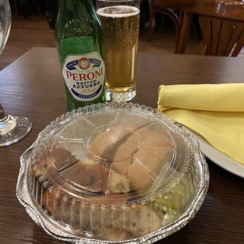 Riccardo Trattoria - a plate of food and a glass of beer - Italian Near Me - Chicago, Illinois