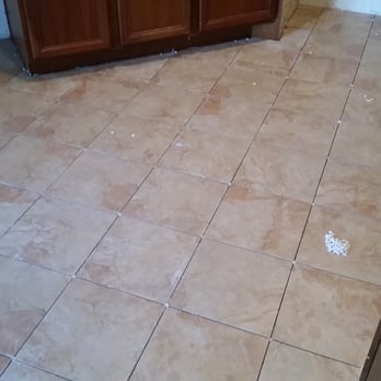 MD Gates Flooring - Kitchen in process. diagonal lay. - Flooring Near Me