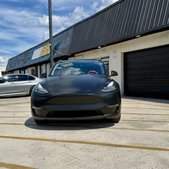 WeTint - Tesla Model Y wrapped in premium satin black vinyl. - Car Window Tinting Near Me - Jacksonville, Florida WeTint - Tesla Model Y wrapped in premium satin black vinyl. - Car Window Tinting Near Me - Jacksonville, Florida