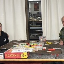 Playing board games on one of their tables! Staff was very polite and friendly!
