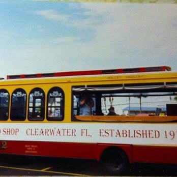 Pro Shop Pub - a yellow and red trolley - Gay Bars Near Me - Clearwater, Florida