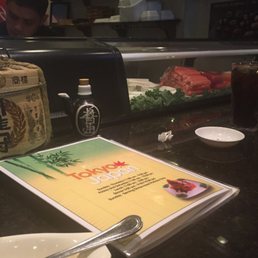 Sitting at the sushi bar watching the master do his thing Sitting at the sushi bar watching the master do his thing