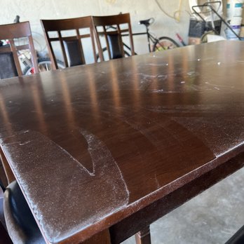 Ashley Store - My table was delivered dusty scratched on a lot of legs and stained with dirt on the leather - Furniture Stores Near Me - West Covina, California