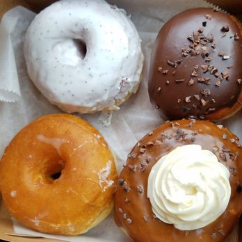 Grindstone Coffee & Donuts - Bottom left- plain, lemon poppy seed, Boston cream, some sort of coffee chocolate mocha with white cream donut! - Donuts Near Me - Sag Harbor, New York Grindstone Coffee & Donuts - Bottom left- plain, lemon poppy seed, Boston cream, some sort of coffee chocolate mocha with white cream donut! - Donuts Near Me - Sag Harbor, New York